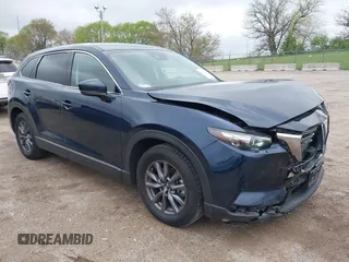2020 Mazda CX-9 Touring z VIN JM3TCBCY1L0423246, wystawiony jako IAAI lot #42177276 z przebiegiem 39 048 mil mil oraz . Historia ofert i sprzedaży dostępna na DreamBid. Obrazek 1.