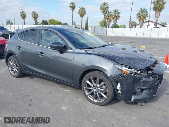 2018 Mazda 3 Touring with VIN 3MZBN1L32JM268582, listed as a IAAI auction lot 42072435 with 61,417 mi miles. Bid and sale history available at carsss.com. Image 1.
