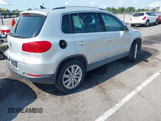 2012 Volkswagen Tiguan SE with VIN WVGAV7AX9CW581957, listed as a IAAI auction lot 42407148 with 135,553 mi miles and . Bid and sale history available at DreamBid. Image 4.