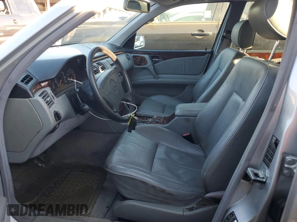 1999 Mercedes-Benz E 320 with VIN WDBJF65H8XA734585, listed as a Copart auction lot 79141194 with 196,908 mi miles and Salvage Title. Bid and sale history available at DreamBid. Image 7.