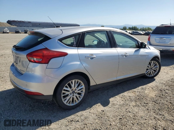2017 Ford Focus Titanium with VIN 1FADP3N21HL279810, listed as a Copart auction lot 57950195 with 121,139 mi miles and Salvage title. Bid and sale history available at DreamBid. Image 3.