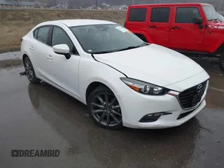 2018 Mazda 3 Touring z VIN 3MZBN1V3XJM256788, wystawiony jako IAAI lot #41710850 z przebiegiem 85 244 mil mil oraz . Historia ofert i sprzedaży dostępna na DreamBid. Obrazek 1.