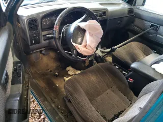 1997 Nissan Frontier XE with VIN 1N6SD16Y2VC338776, listed as a Copart auction lot 45020595 with 243,030 mi miles and Salvage title. Bid and sale history available at DreamBid. Image 8.
