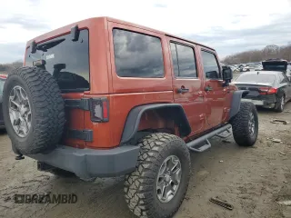 2014 Jeep Wrangler Unlimited Rubicon with VIN 1C4BJWFG0EL187243, listed as a Copart auction lot 45865005 with 53,064 mi miles and Salvage title. Bid and sale history available at DreamBid. Image 3.