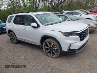 2023 Honda Pilot Elite with VIN 5FNYG1H80PB020937, listed as a IAAI auction lot 42024743 with 20,740 mi miles and . Bid and sale history available at DreamBid. Image 1.