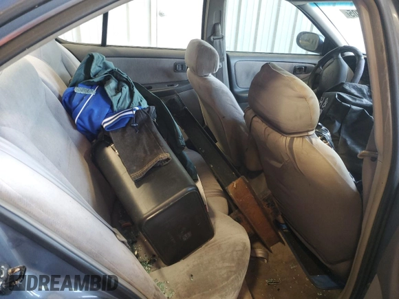 1999 Nissan Altima XE z VIN 1N4DL01D9XC148205, wystawiony jako Copart lot #50392305 z przebiegiem 90 698 mil mil oraz Szkoda całkowita • Salvage title. Historia ofert i sprzedaży dostępna na DreamBid. Obrazek 10.