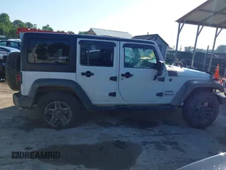 2016 Jeep Wrangler Unlimited Sport z VIN 1C4BJWDG5GL257423, wystawiony jako IAAI lot #42530026 z przebiegiem 157 072 mil mil oraz . Historia ofert i sprzedaży dostępna na DreamBid. Obrazek 13.
