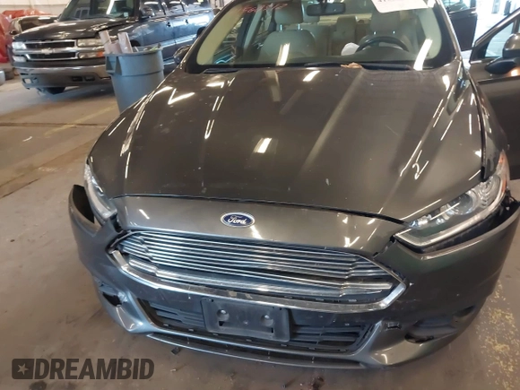 2016 Ford Fusion SE Hybrid with VIN 3FA6P0LU9GR235291, listed as a IAAI auction lot 41560312 with 112,777 mi miles. Bid and sale history available at carsss.com. Image 6.
