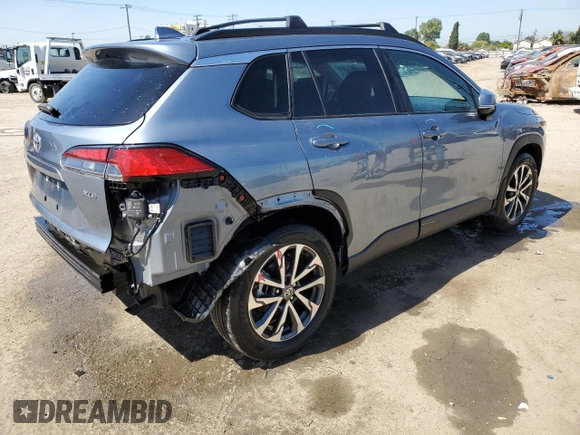 2023 Toyota Corolla Cross XLE with VIN 7MUDAAAG0PV063242, listed as a Copart auction lot 52511585 with 10,695 mi miles and Salvage title. Bid and sale history available at DreamBid. Image 3.