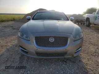 2014 Jaguar XJ Portfolio with VIN SAJWJ2GD7E8V61558, listed as a Copart auction lot 66850034 with 130,984 mi miles and Salvage title. Bid and sale history available at DreamBid. Image 5.