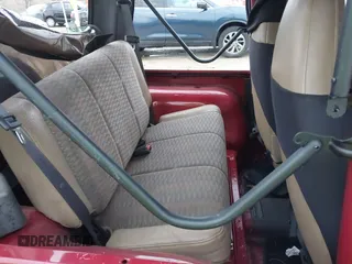 1999 Jeep Wrangler SE with VIN 1J4FY29P6XP408738, listed as a IAAI auction lot 41716999 with 124,692 mi miles. Bid and sale history available at carsss.com. Image 8.