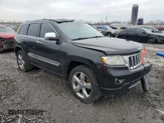 2013 Jeep Grand Cherokee Overland with VIN 1C4RJECG1DC546398, listed as a Copart auction lot 45834595 with 214,975 mi miles and Salvage Title. Bid and sale history available at carsss.com. Image 4.
