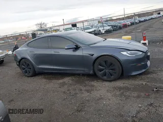 2021 Tesla Model S Long Range with VIN 5YJSA1E51MF440929, listed as a IAAI auction lot 41144902 with Not provided miles and . Bid and sale history available at DreamBid. Image 13.