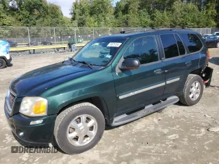 2003 GMC Envoy SLT with VIN 1GKDT13S032396374, listed as a Copart auction lot 74675134 with 115,280 mi miles and Salvage Title. Bid and sale history available at carsss.com. Image 1.