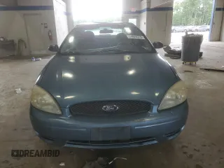 2007 Ford Taurus SE with VIN 1FAFP53U17A215432, listed as a Copart auction lot 64029215 with 121,190 mi miles and Salvage title. Bid and sale history available at DreamBid. Image 5.