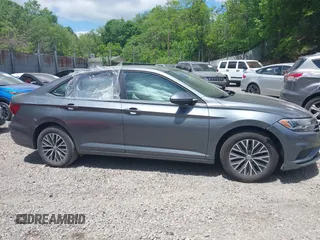 2019 Volkswagen Jetta S z VIN 3VWC57BUXKM121316, wystawiony jako IAAI lot #42290107 z przebiegiem 117 371 mil mil oraz . Historia ofert i sprzedaży dostępna na DreamBid. Obrazek 14.