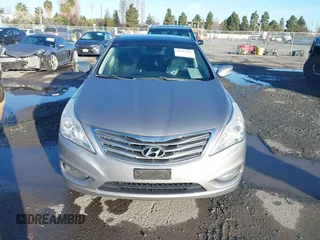 2013 Hyundai Azera z VIN KMHFH4JG3DA230844, wystawiony jako IAAI lot #41817997 z przebiegiem 129 163 mil mil oraz . Historia ofert i sprzedaży dostępna na DreamBid. Obrazek 13.