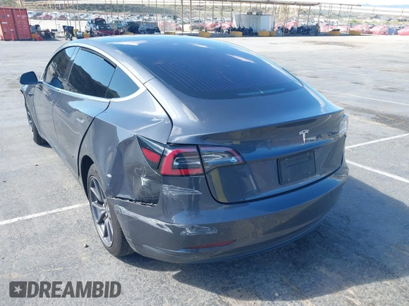 2019 Tesla Model 3 Mid Range with VIN 5YJ3E1EA6KF307456, listed as a IAAI auction lot 41944454 with 99,059 mi miles and . Bid and sale history available at DreamBid. Image 3.
