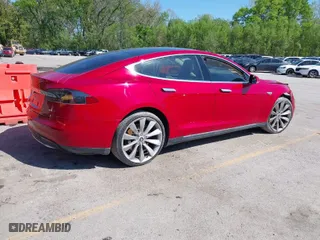 2014 Tesla Model S 60 kWh Battery with VIN 5YJSA1H1XEFP38289, listed as a IAAI auction lot 42092052 with 75,668 mi miles. Bid and sale history available at carsss.com. Image 4.