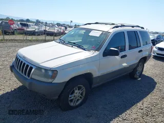2002 Jeep Grand Cherokee Laredo with VIN 1J4GW48SX2C247709, listed as a IAAI auction lot 42444030 with 196,591 mi miles and . Bid and sale history available at DreamBid. Image 2.