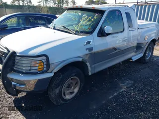 1998 Ford F-150 with VIN 2FTZX08W0WCA98105, listed as a IAAI auction lot 40930475 with Not provided miles and . Bid and sale history available at DreamBid. Image 6.