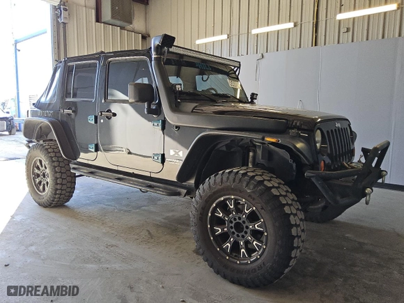 2007 Jeep Wrangler Unlimited X with VIN 1J4GA391X7L145896, listed as a Copart auction lot 45404625 with 152,278 mi miles and Clean Title. Bid and sale history available at carsss.com. Image 4.