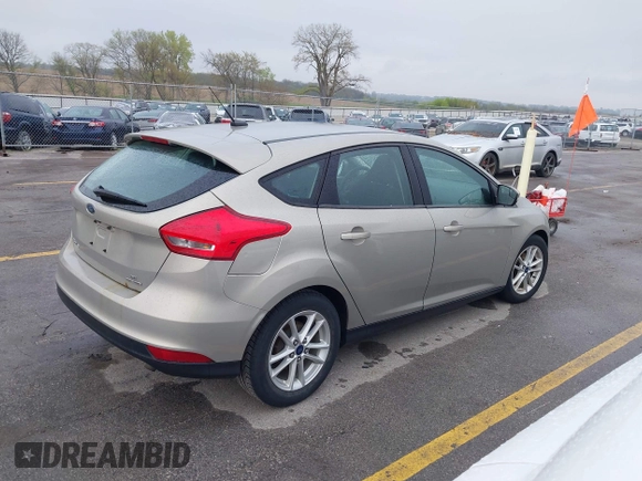 2015 Ford Focus SE with VIN 1FADP3K21FL211511, listed as a IAAI auction lot 42153828 with 126,111 mi miles. Bid and sale history available at carsss.com. Image 4.