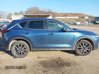 2018 Mazda CX-5 Touring z VIN JM3KFBCM2J0461954, wystawiony jako IAAI lot #41655865 z przebiegiem 129 333 mil mil oraz . Historia ofert i sprzedaży dostępna na DreamBid. Obrazek 12.