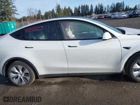 2024 Tesla Model Y Long Range with VIN 7SAYGDEE1RF056816, listed as a IAAI auction lot 41809125 with 6,434 mi miles and . Bid and sale history available at DreamBid. Image 14.