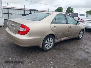 2002 Toyota Camry LE z VIN 4T1BE32K52U086150, wystawiony jako IAAI lot #42126685 z przebiegiem 175 212 mil mil oraz . Historia ofert i sprzedaży dostępna na DreamBid. Obrazek 4.