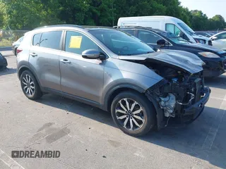 2018 Kia Sportage EX with VIN KNDPN3AC7J7387617, listed as a IAAI auction lot 42414659 with 76,992 mi miles and . Bid and sale history available at DreamBid. Image 1.