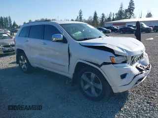 2015 Jeep Grand Cherokee Overland with VIN 1C4RJFCT6FC653386, listed as a IAAI auction lot 42084723 with 101,993 mi miles. Bid and sale history available at carsss.com. Image 1.