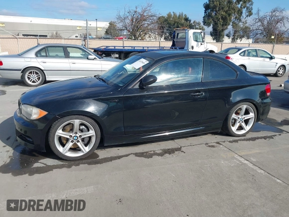 2008 BMW 1 Series 135i with VIN WBAUC73548VF25411, listed as a IAAI auction lot 41479409 with 153,643 mi miles. Bid and sale history available at carsss.com. Image 2.