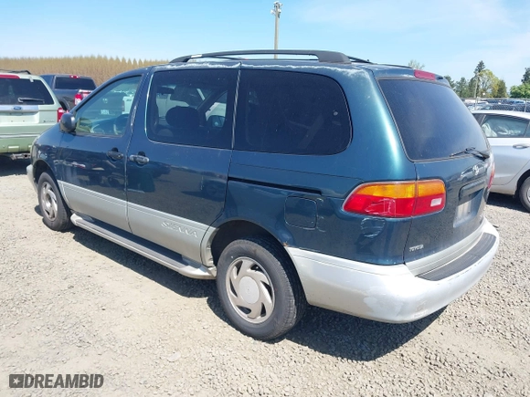 1998 Toyota Sienna LE with VIN 4T3ZF13CXWU023663, listed as a IAAI auction lot 42011727 with 214,972 mi miles. Bid and sale history available at carsss.com. Image 3.