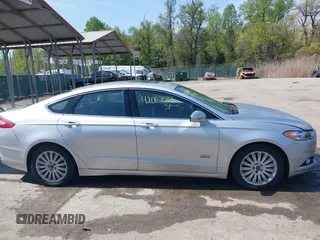 2016 Ford Fusion Energi SE Luxury with VIN 3FA6P0PU8GR273122, listed as a IAAI auction lot 42062083 with 166,318 mi miles. Bid and sale history available at carsss.com. Image 13.