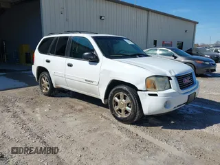 2002 GMC Envoy SLT z VIN 1GKDS13S422350662, wystawiony jako IAAI lot #41668585 z przebiegiem 256 815 mil mil oraz . Historia ofert i sprzedaży dostępna na DreamBid. Obrazek 1.
