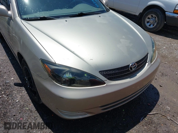 2002 Toyota Camry LE z VIN 4T1BE32K42U592181, wystawiony jako IAAI lot #42206721 z przebiegiem 299 947 mil mil oraz . Historia ofert i sprzedaży dostępna na DreamBid. Obrazek 6.