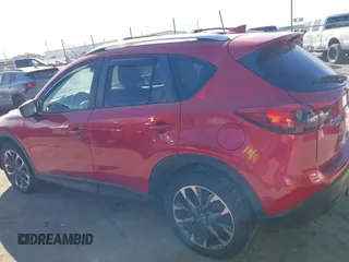 2016 Mazda CX-5 Grand Touring with VIN JM3KE4DY0G0709563, listed as a IAAI auction lot 41886956 with 156,769 mi miles. Bid and sale history available at carsss.com. Image 15.