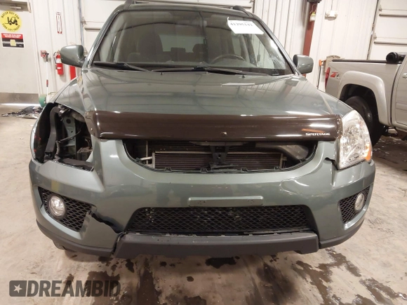 2009 Kia Sportage LX with VIN KNDJE723097558182, listed as a IAAI auction lot 41295142 with 147,200 mi miles. Bid and sale history available at carsss.com. Image 6.