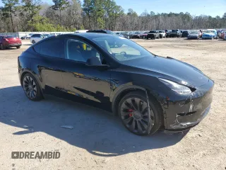 2023 Tesla Model Y Performance with VIN 7SAYGDEF2PF828973, listed as a Copart auction lot 45276585 with 15,750 mi miles and Salvage Title. Bid and sale history available at DreamBid. Image 4.