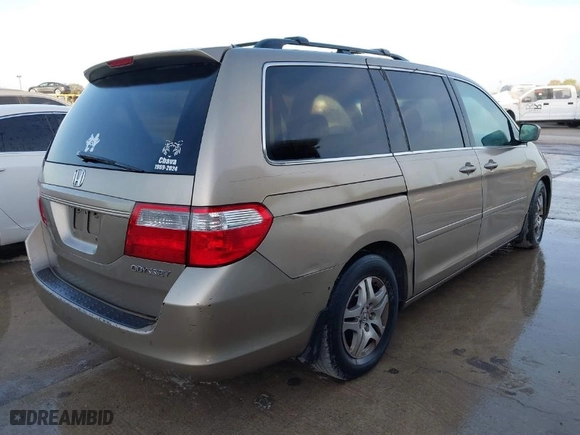 2005 Honda Odyssey EX-L with VIN 5FNRL38735B015831, listed as a IAAI auction lot 41730710 with 295,586 mi miles. Bid and sale history available at carsss.com. Image 4.