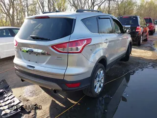 2013 Ford Escape SEL with VIN 1FMCU0HX4DUB98238, listed as a IAAI auction lot 41973221 with 131,590 mi miles and . Bid and sale history available at DreamBid. Image 4.