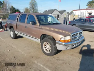 2001 Dodge Dakota Sport with VIN 1B7GL2ANX1S217475, listed as a IAAI auction lot 41917542 with 213,425 mi miles. Bid and sale history available at carsss.com. Image 1.