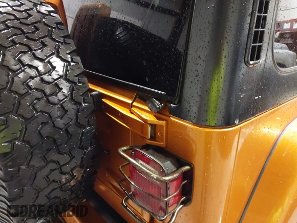 1998 Jeep Wrangler Sahara z VIN 1J4FY49S1WP802940, wystawiony jako IAAI lot #41433820 z przebiegiem 122 180 mil mil oraz . Historia ofert i sprzedaży dostępna na DreamBid. Obrazek 12.