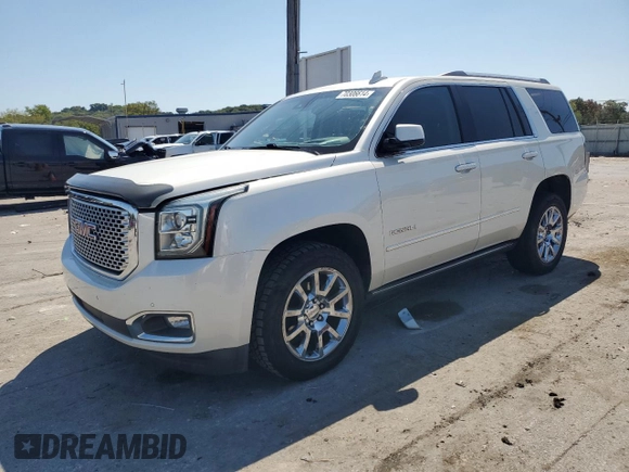 2015 GMC Yukon Denali with VIN 1GKS2CKJ3FR663324, listed as a Copart auction lot 70306614 with 154,234 mi miles and Salvage Title. Bid and sale history available at carsss.com. Image 1.