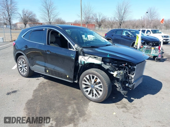 2020 Ford Escape Titanium z VIN 1FMCU9J98LUA44923, wystawiony jako IAAI lot #41779691 z przebiegiem 73 259 mil mil oraz . Historia ofert i sprzedaży dostępna na DreamBid. Obrazek 1.
