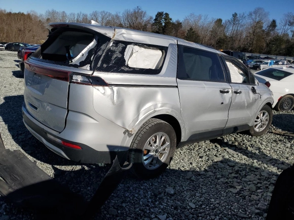 2023 Kia Carnival LX with VIN KNDNB4H35P6254056, listed as a Copart auction lot 87619955 with 0 mi miles and Salvage Title. Bid and sale history available at carsss.com. Image 3.