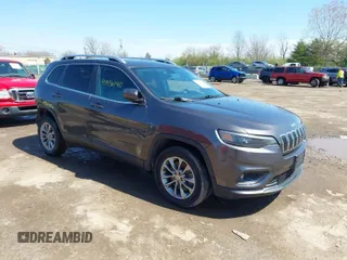 2019 Jeep Cherokee Latitude Plus with VIN 1C4PJLLB7KD269814, listed as a IAAI auction lot 41956140 with 125,934 mi miles. Bid and sale history available at carsss.com. Image 1.