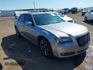 2014 Chrysler 300 with VIN 2C3CCABG1EH228519, listed as a IAAI auction lot 41853366 with 173,577 mi miles. Bid and sale history available at carsss.com. Image 1.