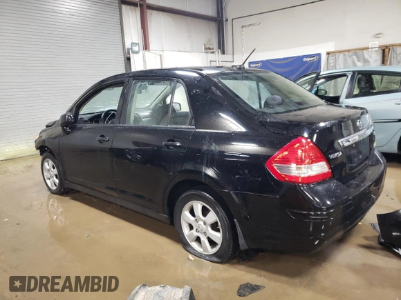 2011 Nissan Versa S with VIN 3N1BC1AP7BL410790, listed as a Copart auction lot 83893614 with 151,077 mi miles and Salvage title. Bid and sale history available at DreamBid. Image 2.